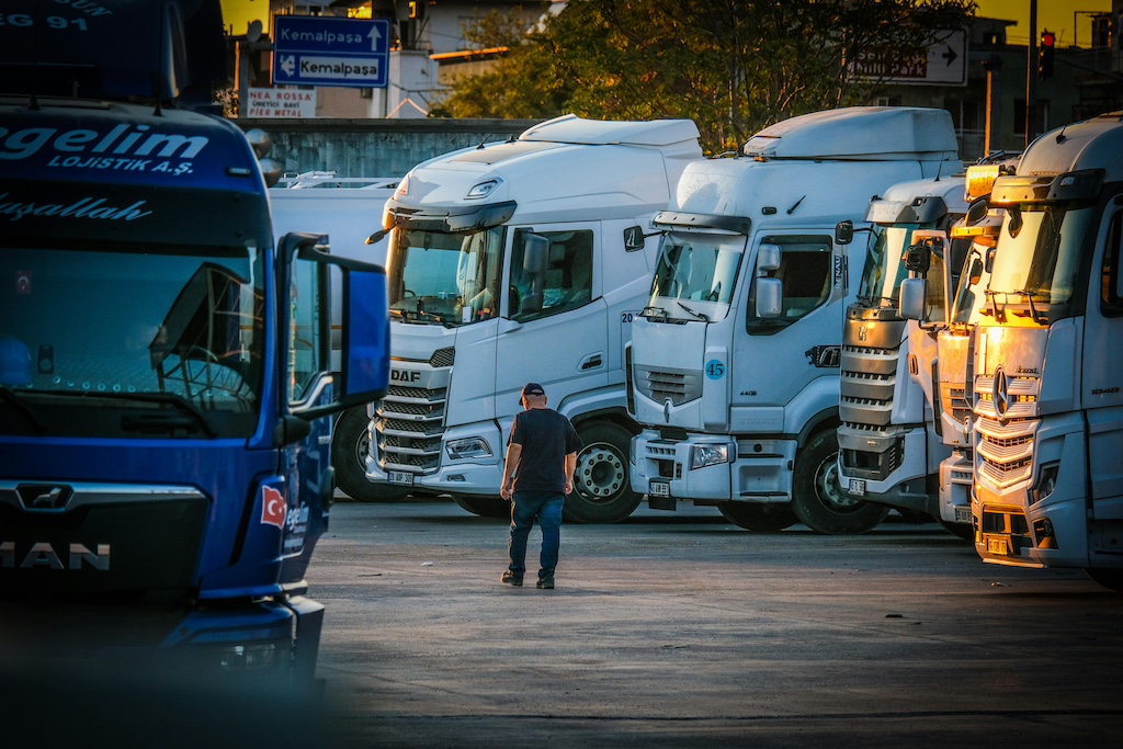 trucks parked at sunset in industrial lot